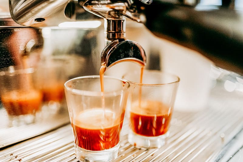 Photo of an espresso machine pressing for two shots of espresso.